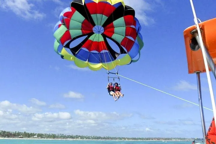 Parasailer above the water at Bávaro beach while parasailing in Punta Cana, Dominican Republic